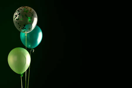 Concept of St. Patrick. Green balloons on dark background, copy space for textの写真素材