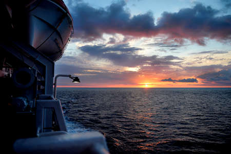 Sunrise in a ferry boat in Mediterranean sea between Menorca islands, Spain.