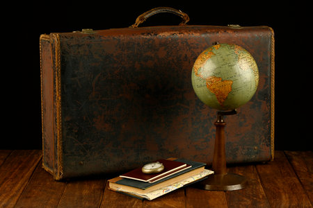 Suitcase, world ball, passports, map and pocket watch, holiday and ready vacation concept, retro pictureの写真素材