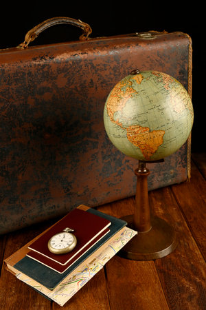 Suitcase, world ball, passports, map and pocket watch, holiday and ready vacation concept, retro pictureの写真素材