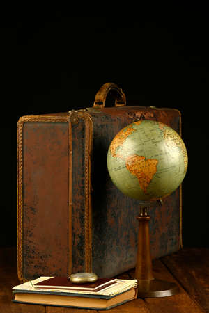 Suitcase, world ball, passports, map and pocket watch, holiday and ready vacation concept, retro pictureの写真素材