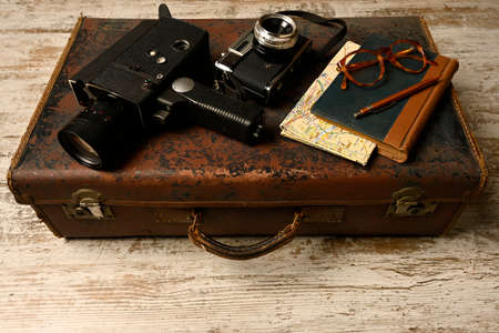 Ready vacation suitcase, with retro cameras, holiday concept, place for textの写真素材