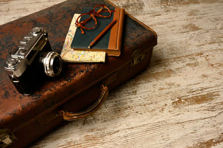 Ready vacation suitcase, with retro cameras, holiday concept, place for textの写真素材