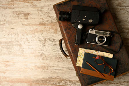 Ready vacation suitcase, with retro cameras, holiday concept, place for textの写真素材