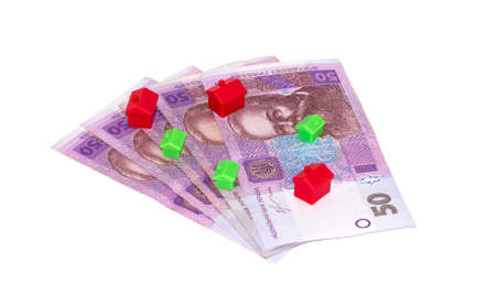 Money and house on a white background isolated