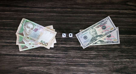 Dice and money on a wooden backgroundの写真素材