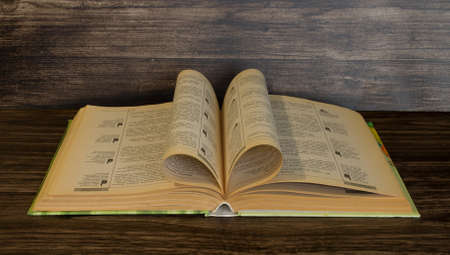 Book on a wooden backgroundの写真素材