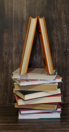 Books on a wooden backgroundの写真素材