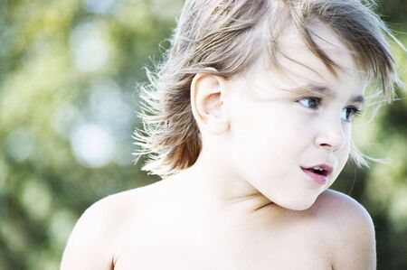 little girl flying hairs portraitの写真素材