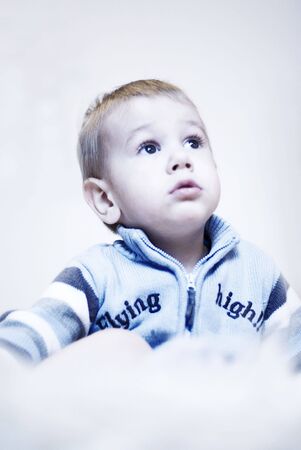 young boy looking thoughtfulの写真素材