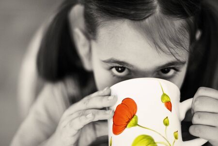 little girl drinking milkの写真素材