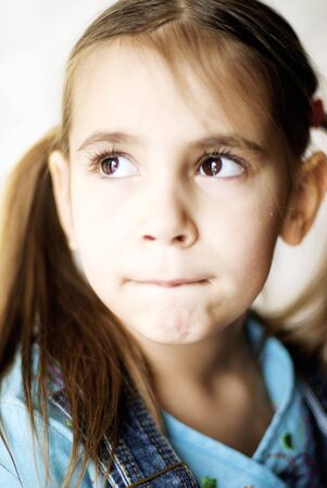 little girl thinkingの写真素材