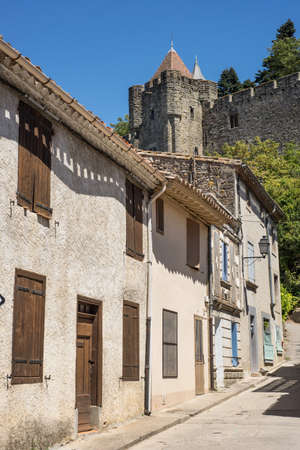 Old street of historical part of Carcassonne below the castle fortressのeditorial素材