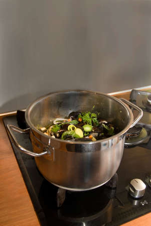 a pan full of tasteful mussuls and vegetables.の写真素材