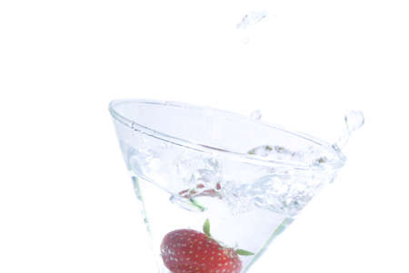 falling strawberry in cocktail glassの写真素材