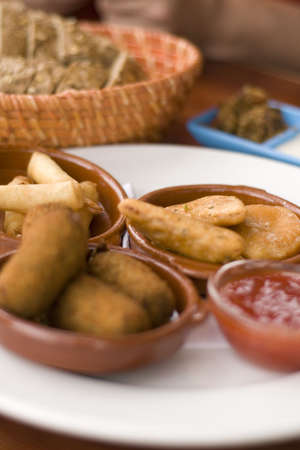 Plate tapas with bread and butterの写真素材