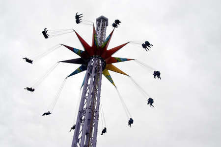 A lot of kids having fun in de spinner speedの写真素材