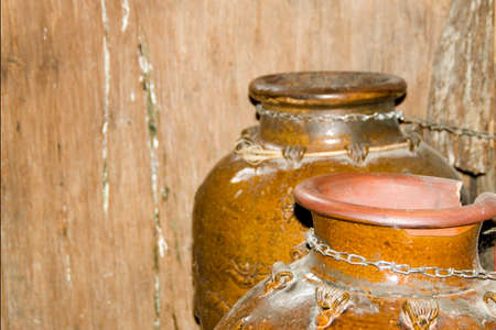 antique pots made of stone, one is brokenの写真素材