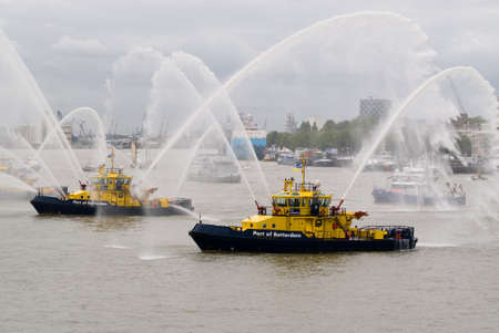 Fire Fighting Boat sprays jets of waterの写真素材