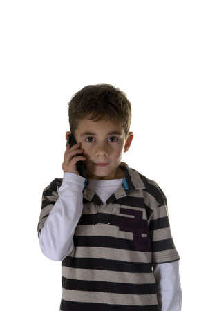 a boy calling with a mobile phoneの写真素材
