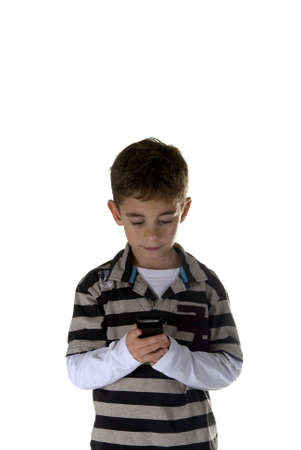 a boy calling with a mobile phoneの写真素材