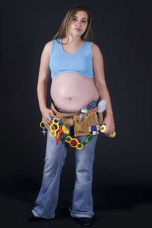 a pregnant woman with a lot of babytoolsの写真素材