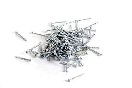 a pile of phillips-head screwsの写真素材