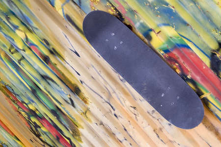 a skateboard and a lot of graffitiの写真素材