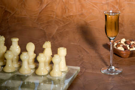 liqueur with nuts and a chess-boardの写真素材