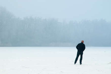 a lonely skater on a winterdayの写真素材