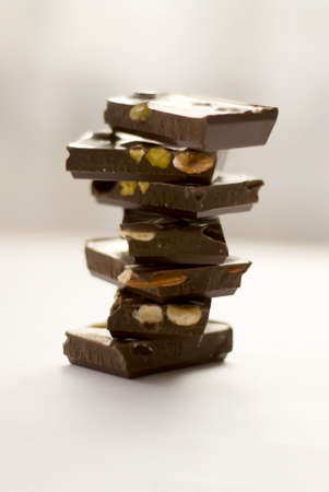 a pile of chocolat with different sorts of nutsの写真素材