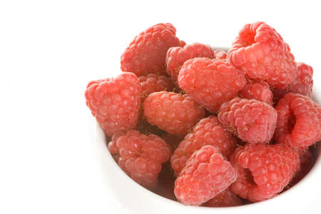 a lot of raspberries in a pot