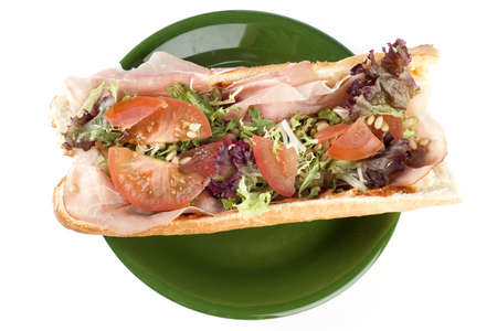 a fresh and healthy baguette with ham and vegetablesの写真素材