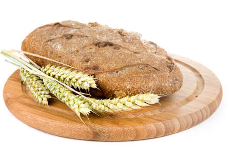nut bread and grain on a cutting boardの写真素材