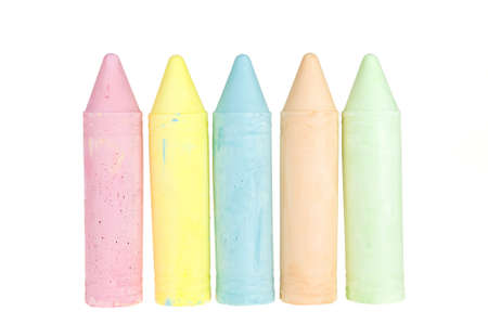 five colorful chalks on a white backgroundの写真素材