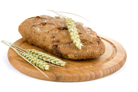 nut bread and grain on a cutting boardの写真素材