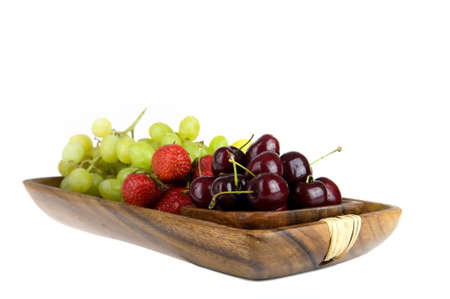 summerfruit in a wooden trayの写真素材