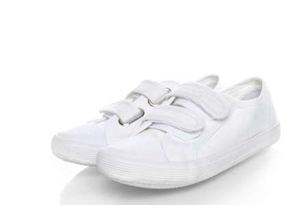 two white sneakers on a white backgroundの写真素材