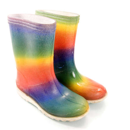 two colorful boots on a white backgroundの写真素材