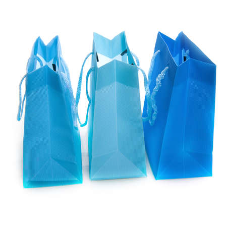 three different colored blue bags on whiteの写真素材