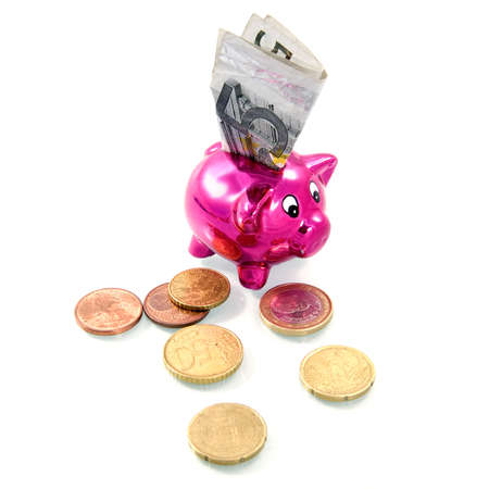 five euro banknote in a pink piggybankの写真素材
