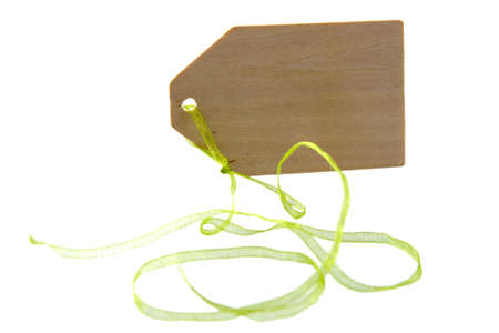 a wooden label with a green ribbonの写真素材
