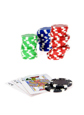 three piles of colorful tokens and cardsの写真素材