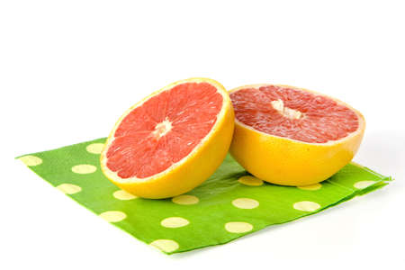 a grapefruit on a dotted napkinの写真素材