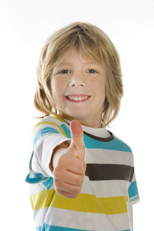 a young boy with his thumbs upの写真素材