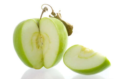 a green apple on a white backgroundの写真素材