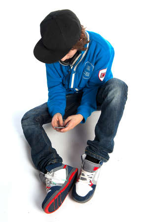 a teenage boy with a telephoneの写真素材