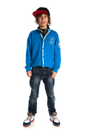 a teenage boy with a cap, a pair of jeans and a blue sweaterの写真素材
