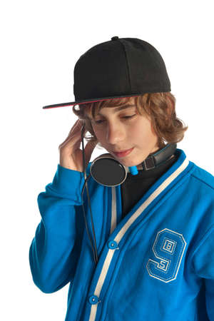 a teenage boy listening to some musicの写真素材