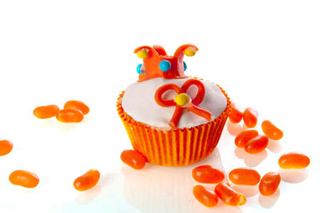 a cupcake with a crown and a orange bow   symbol of the dutch coronation  の写真素材